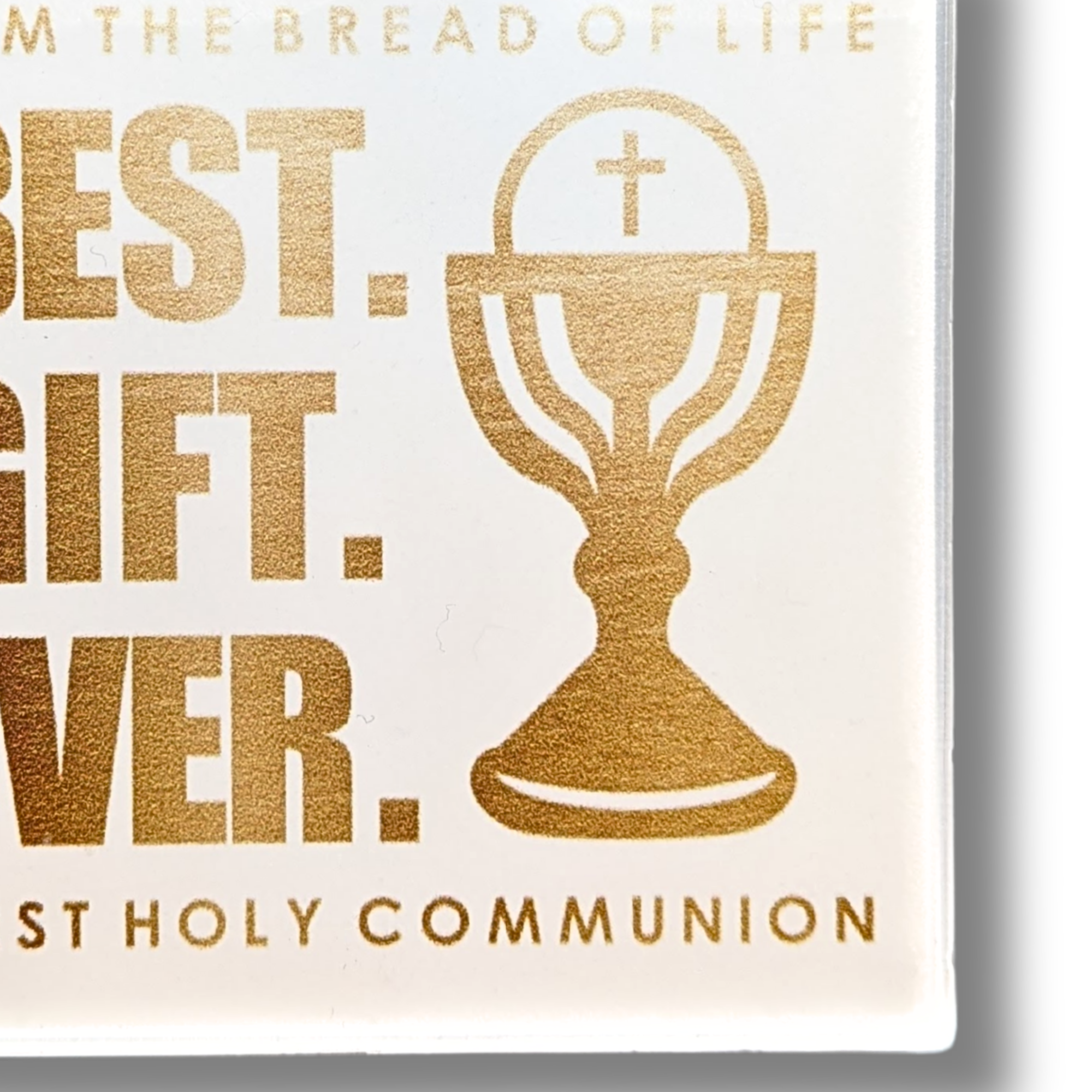 closeup image of keychain gold text and chalice illustration on a white background, celebrating First Holy Communion.