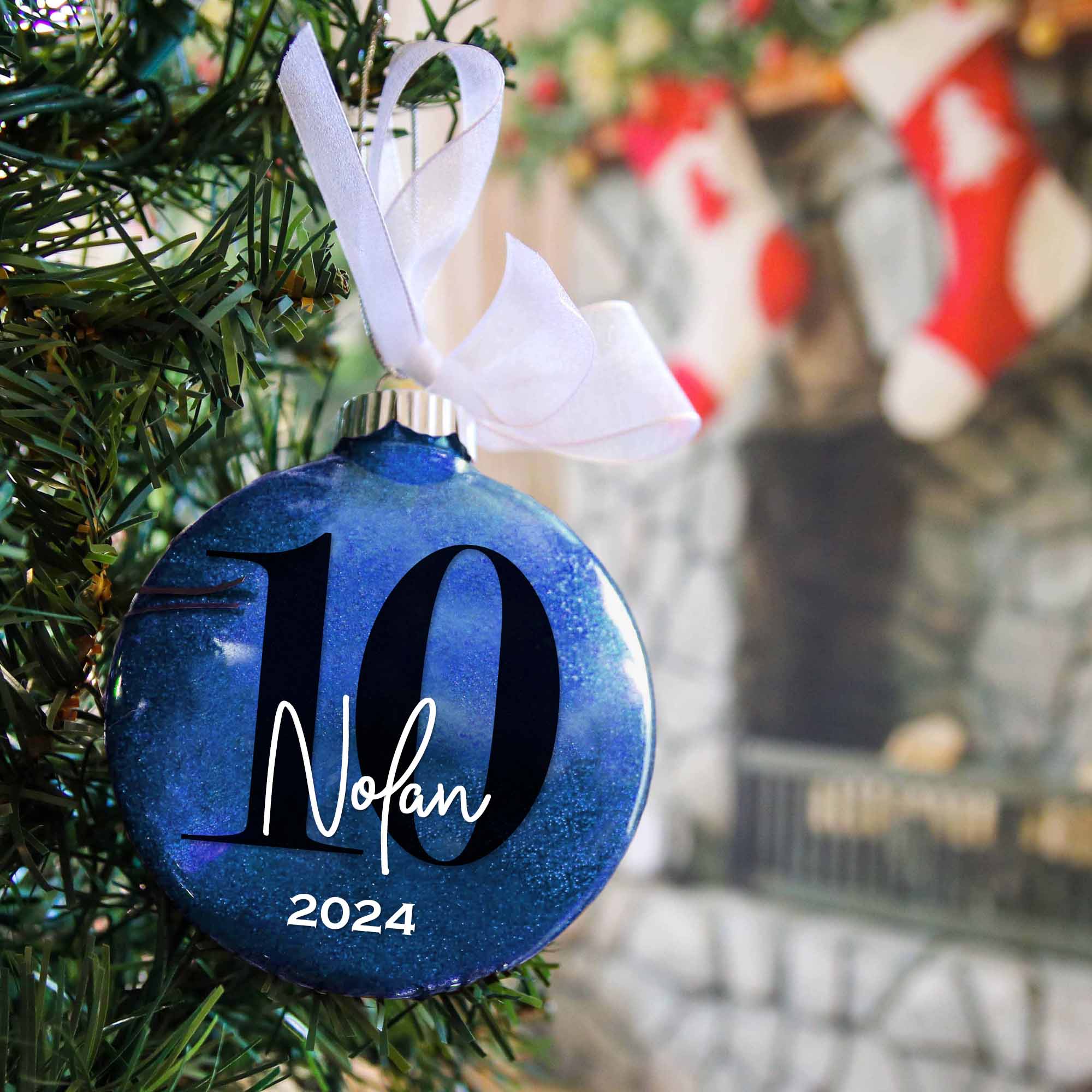 10th birthday royal blue glitter ornament featuring a big number 10 and personalized with name and year