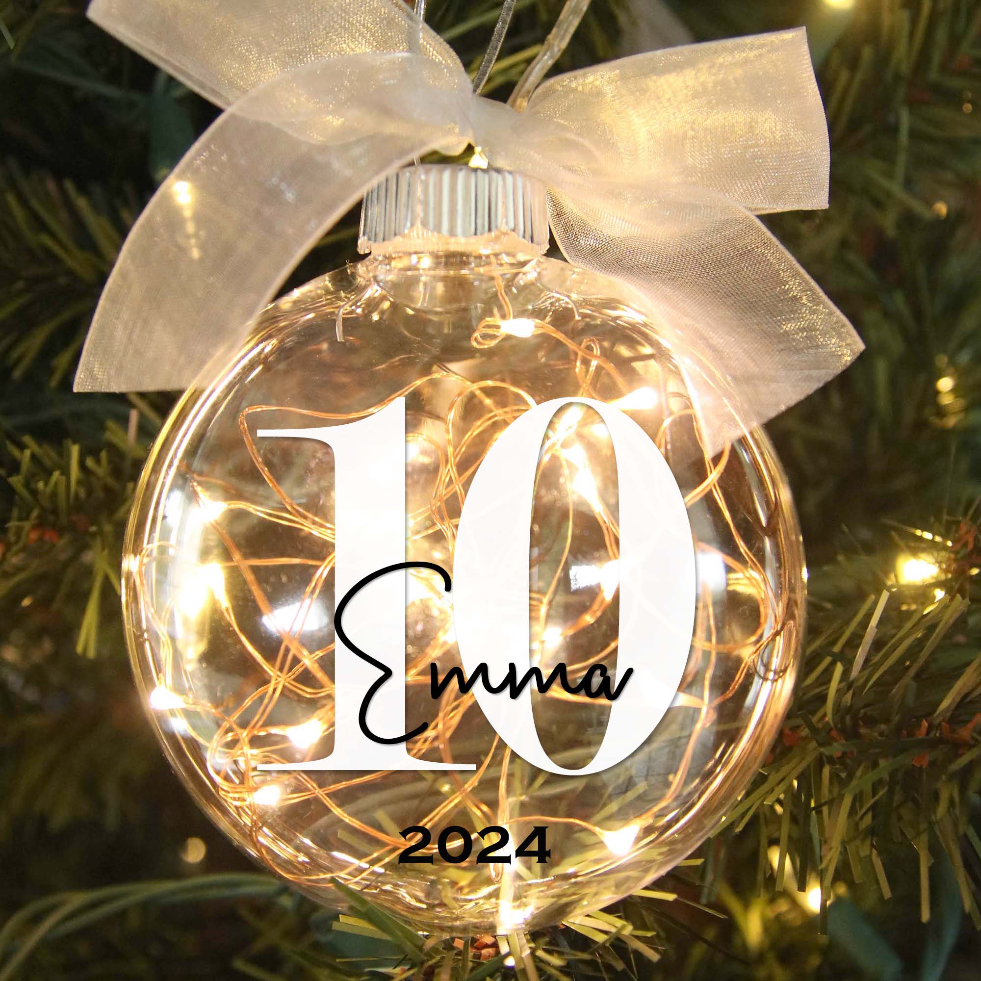 Personalized 10th birthday lighted Christmas ornament in tree