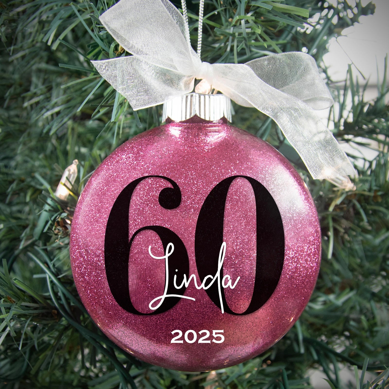 Personalized 60th birthday Christmas ornament in raspberry pink glitter